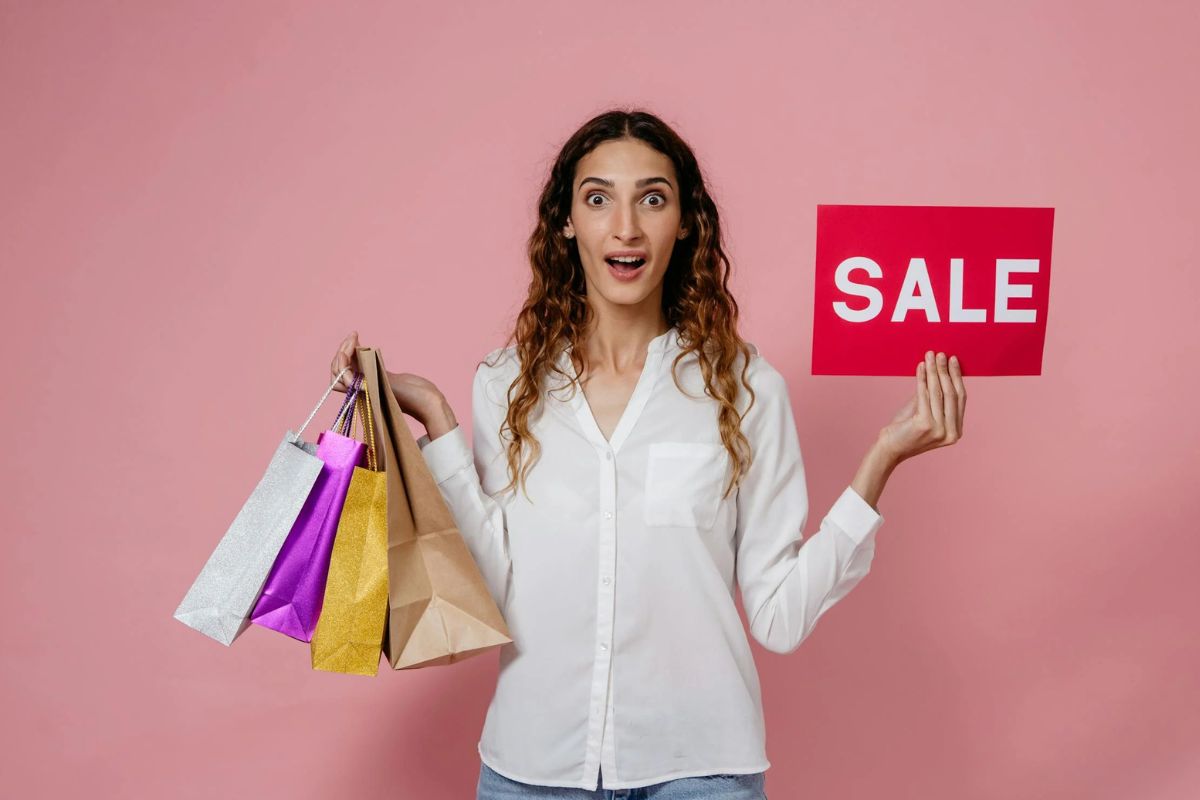 A lady bought printed t-shirt on sale.