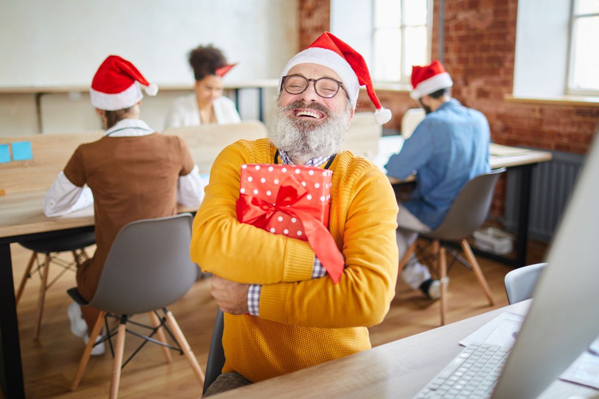 A happy employee after receiving a Christmas present from the company