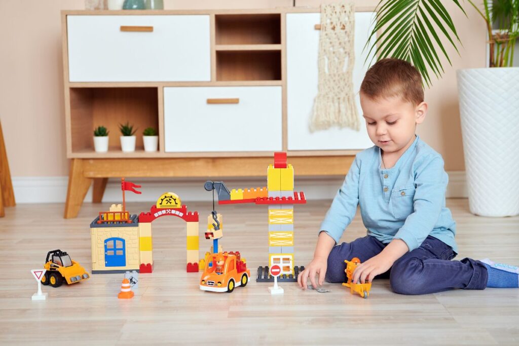 A kid playing with custom toys that he received as a Christmas present.