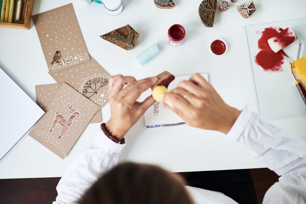 A lady creating different sticker design to sell online. 