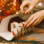 A lady packing Personalized Christmas Gifts for Everyone in the family.