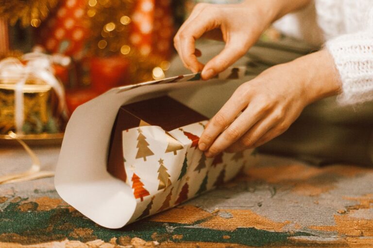 A lady packing Personalized Christmas Gifts for Everyone in the family.