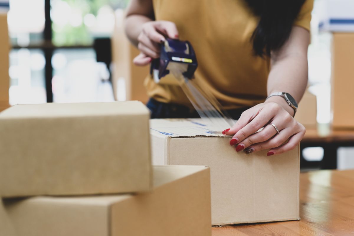 A lady shipping some items that she printed at her home.