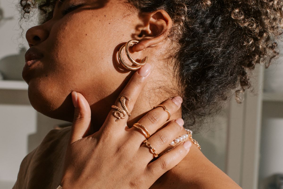 A lady showing her personal style custom made jewelry.