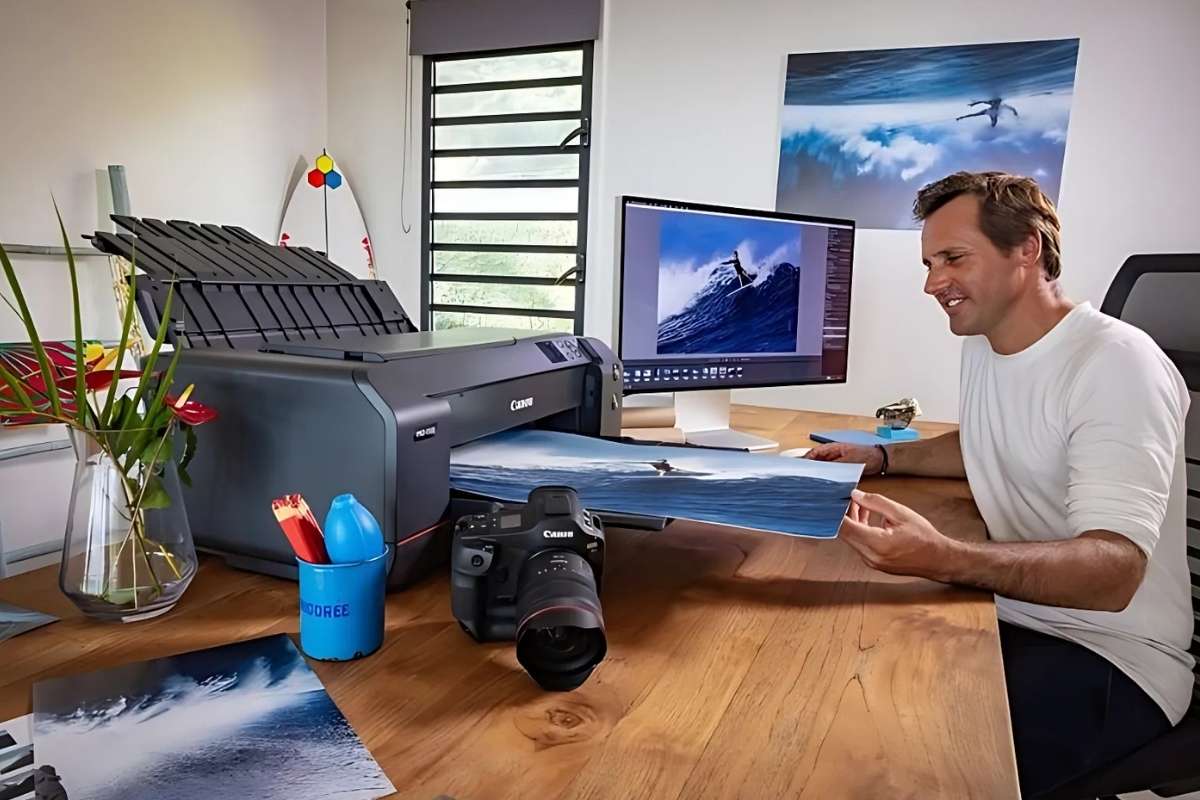 A person is using Canon image PROGRAF PRO-1000 printer for his art 