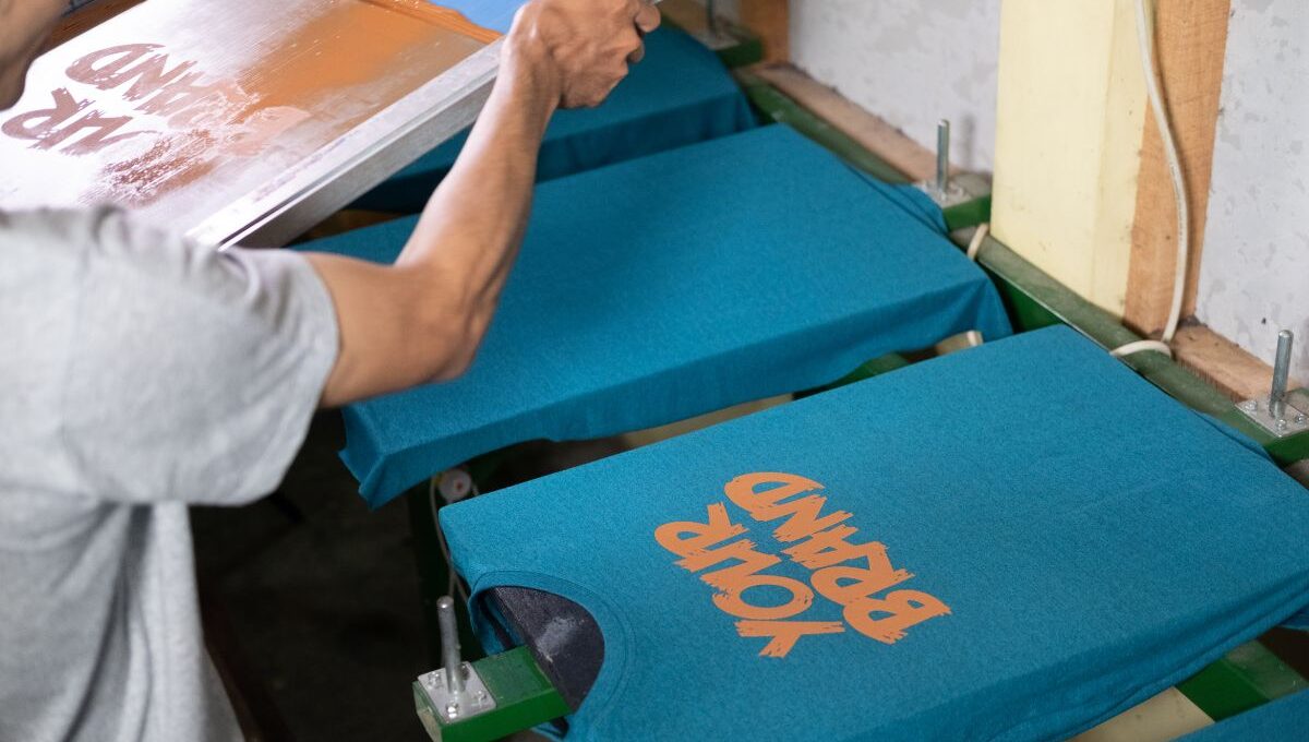 A person printing his custom design on t-shirt