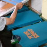 A person printing his custom design on t-shirt