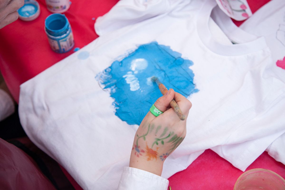 A person testing design on a t-shirt for his print on demand project. 