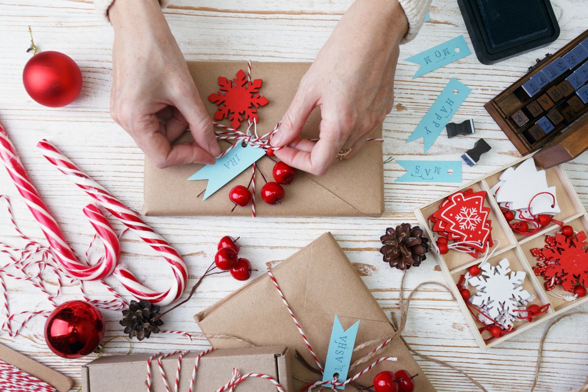 A woman personalizing each client's gifts with personalized messages