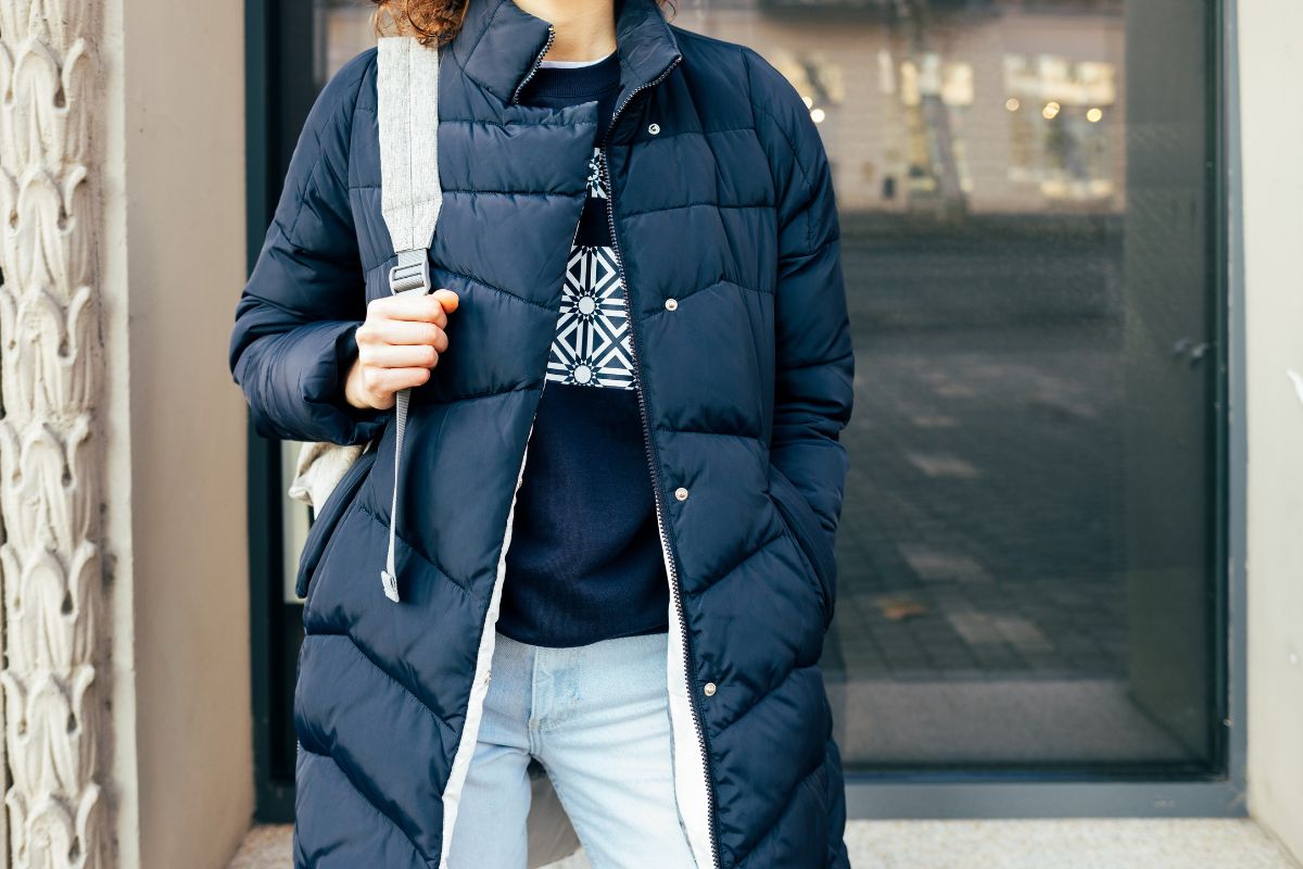 A women wearing her longline puffer jacket.