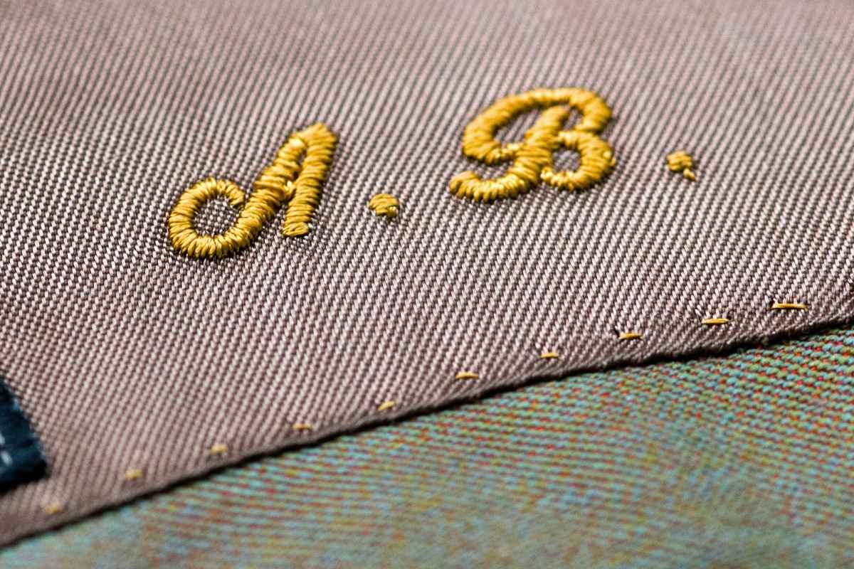 Embroidered initials on a clothing item.