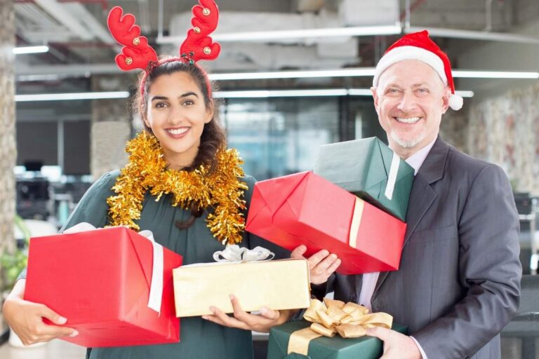 Employees with their Christmas presents