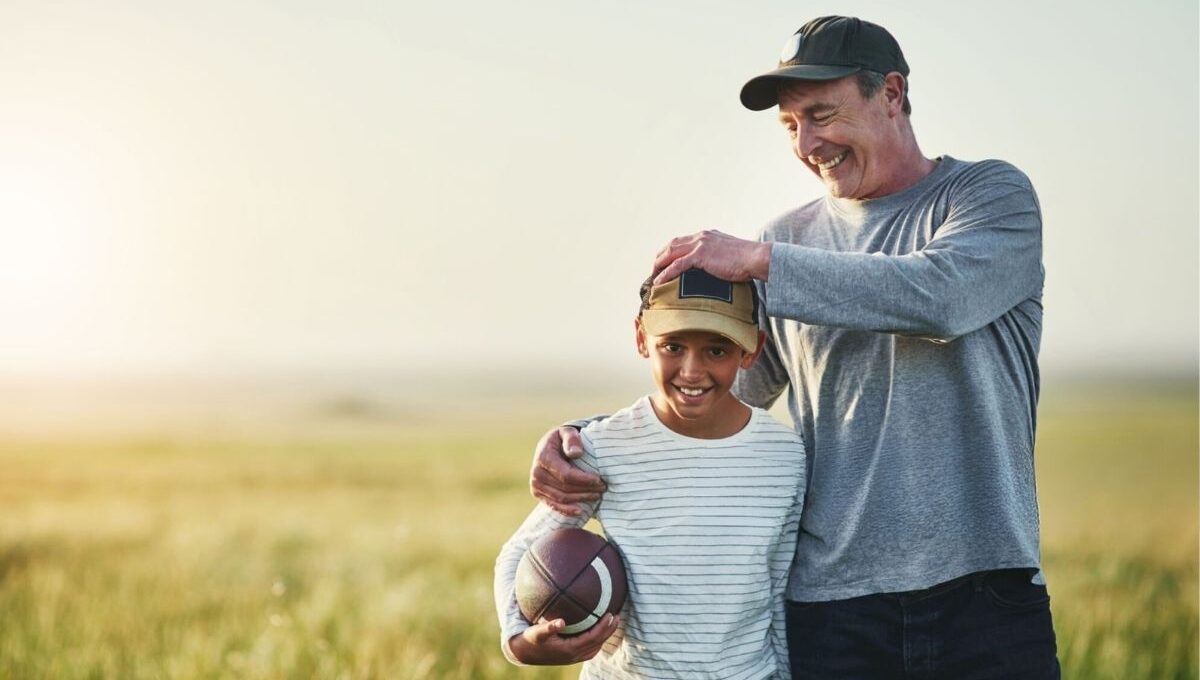 Father and son wearing Best Dad Hats and playing with each other.