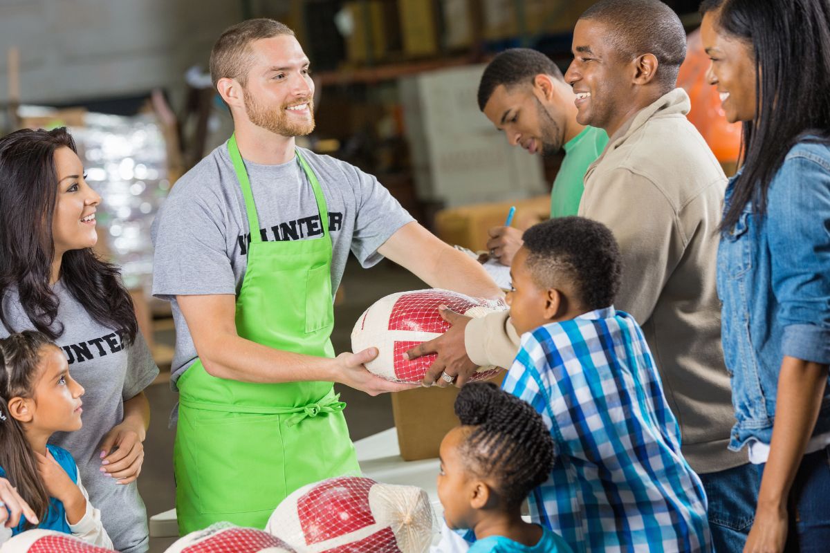 Volunteer giving gifts to church members.