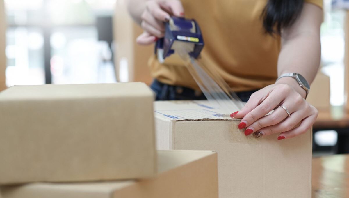 A lady packing her products to sell them on best online marketplaces online