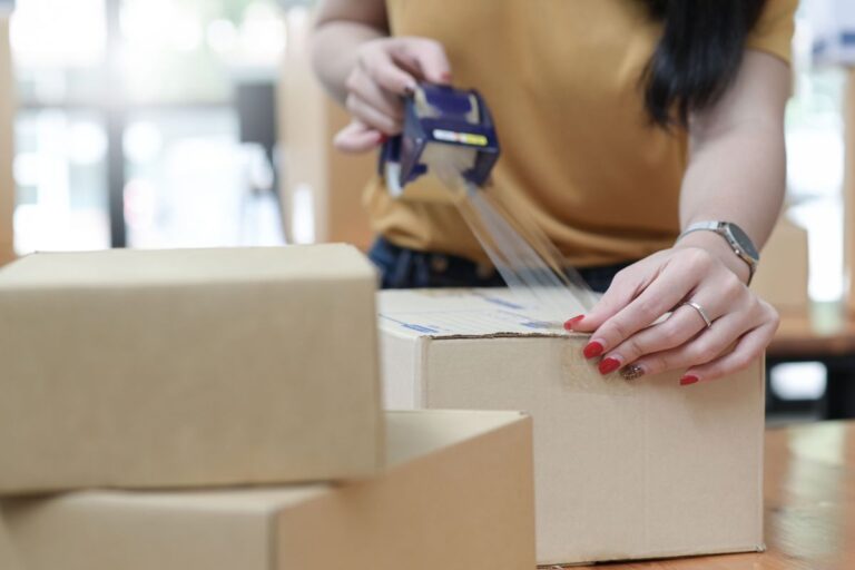 A lady packing her products to sell them on best online marketplaces online