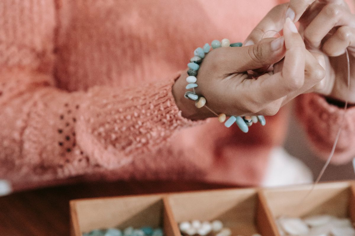 A lady preparing handmade bracelet one of the best friend gifts