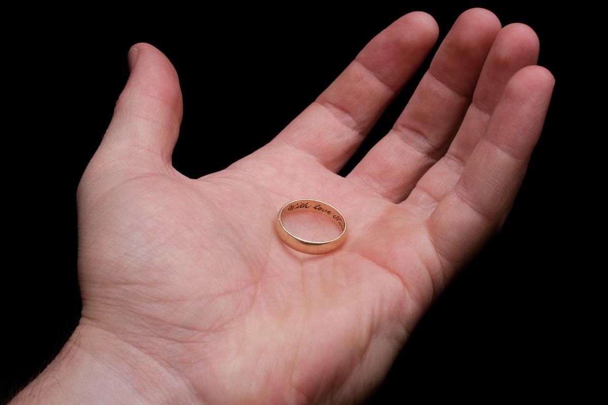 A person Holding engraved ring for his best friend