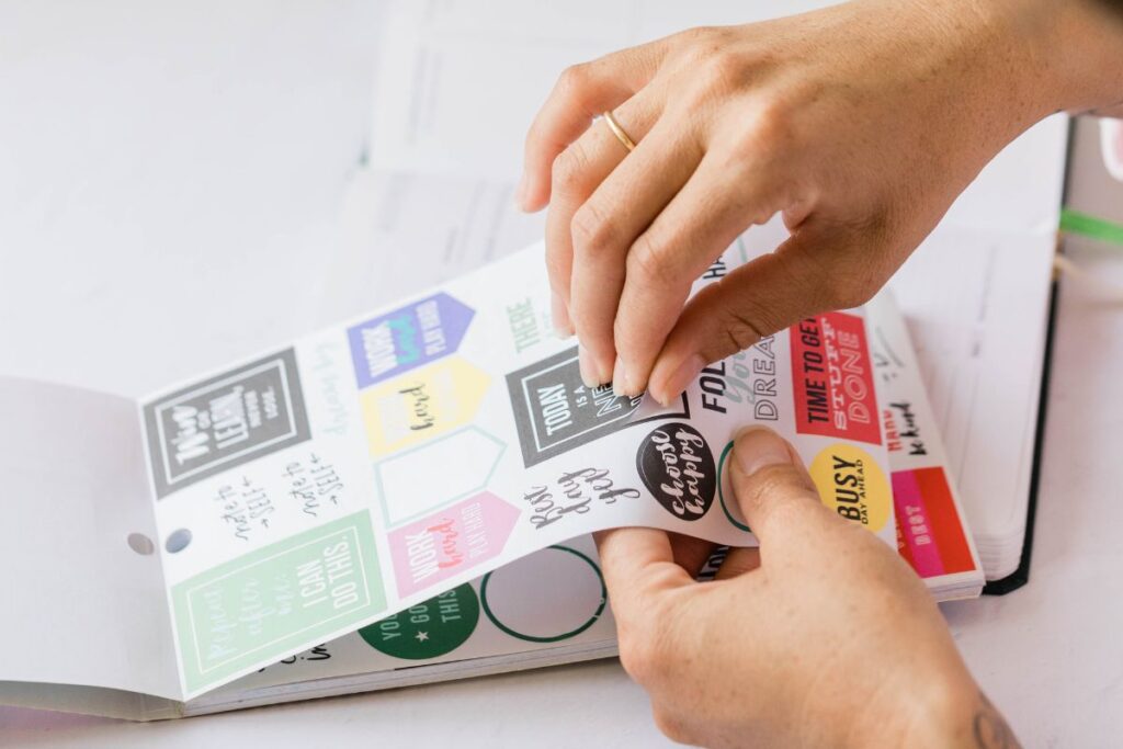 A lady using stickers for her craft