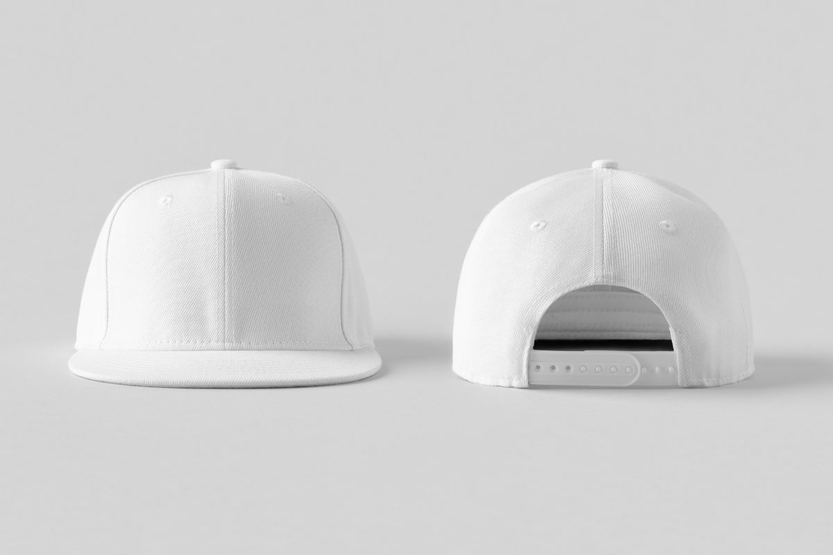 A white colored snapback hat shown in the image