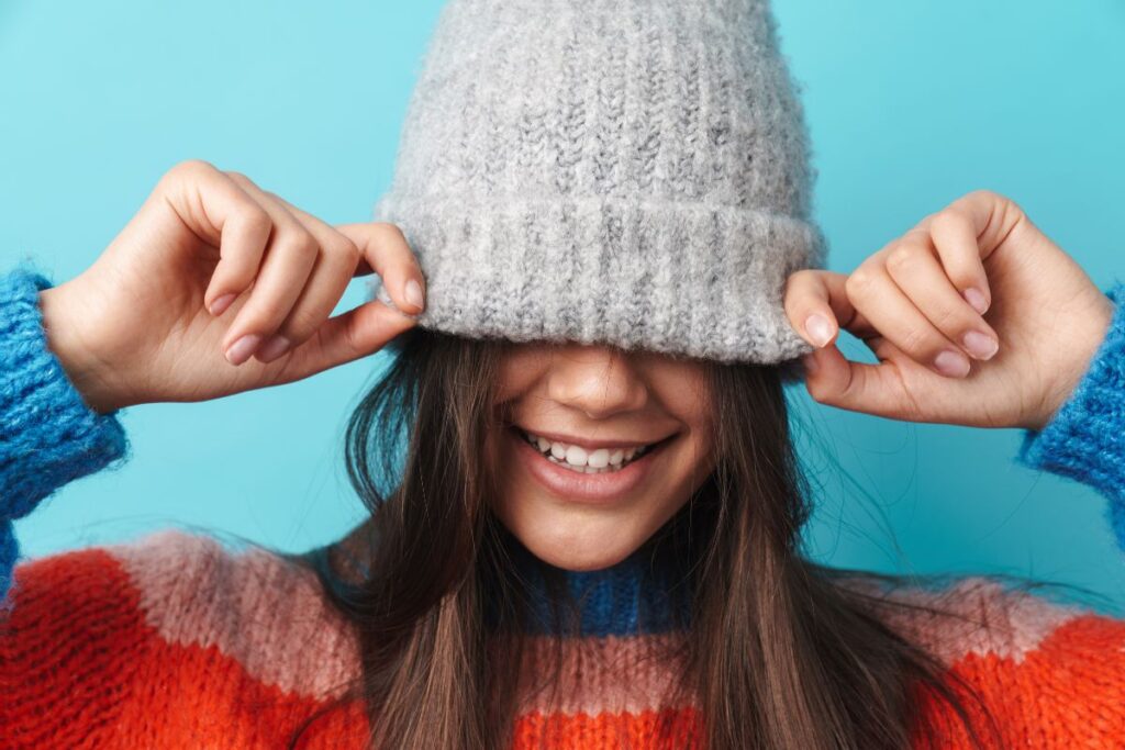 A child wearing embroidered beanie hat