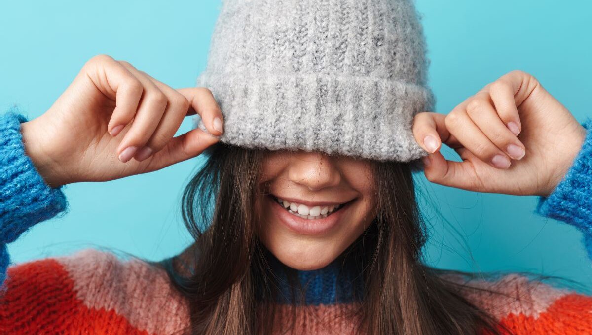 A child wearing embroidered beanie hat