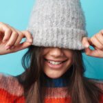 A child wearing embroidered beanie hat