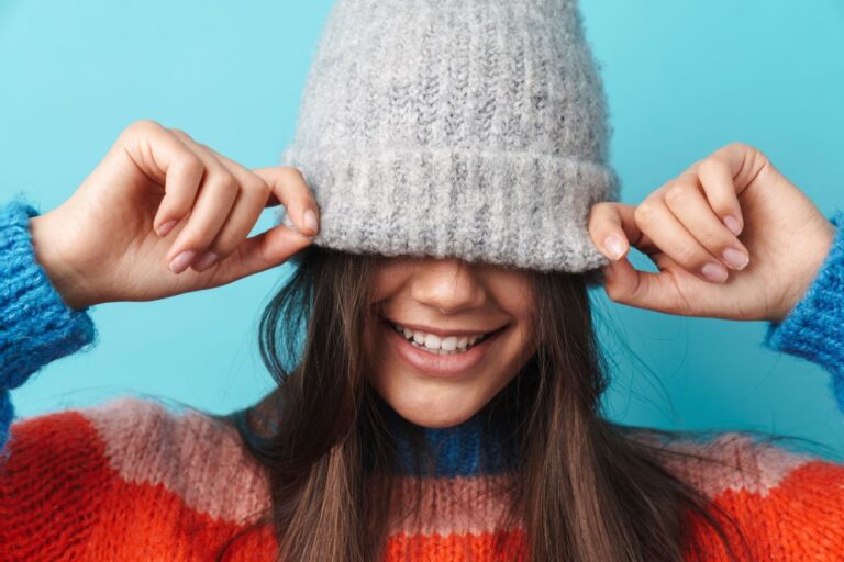 A child wearing embroidered beanie hat
