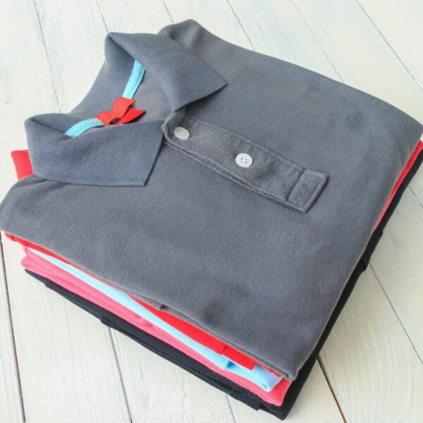 A collection of custom printed polo T-shirts placed together