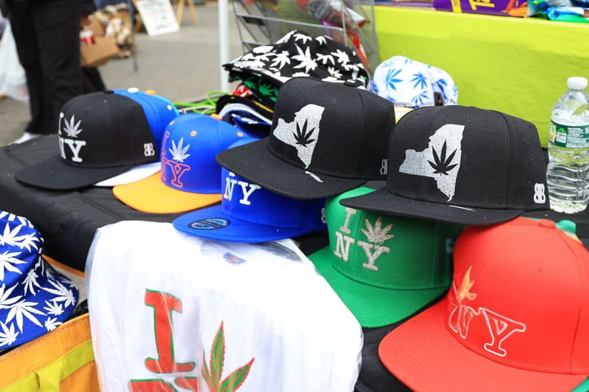 A collection of embroidered snapback hats kept for sale