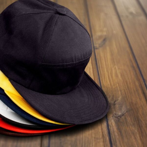 A collection of personalized flat bill hat kept together