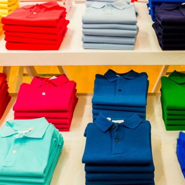 A collection of personalized polo shirt for business kept at a store for sale