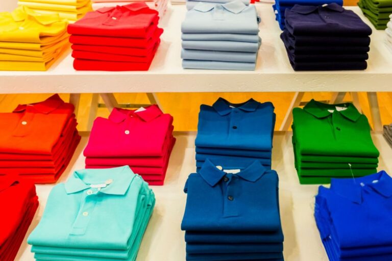 A collection of personalized polo shirt for business kept at a store for sale