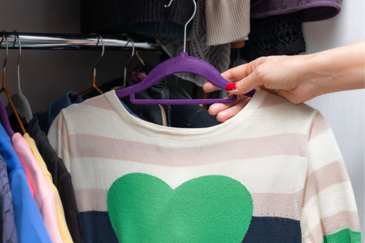 A lady getting ready to wear her custom embroidered sweatshirt