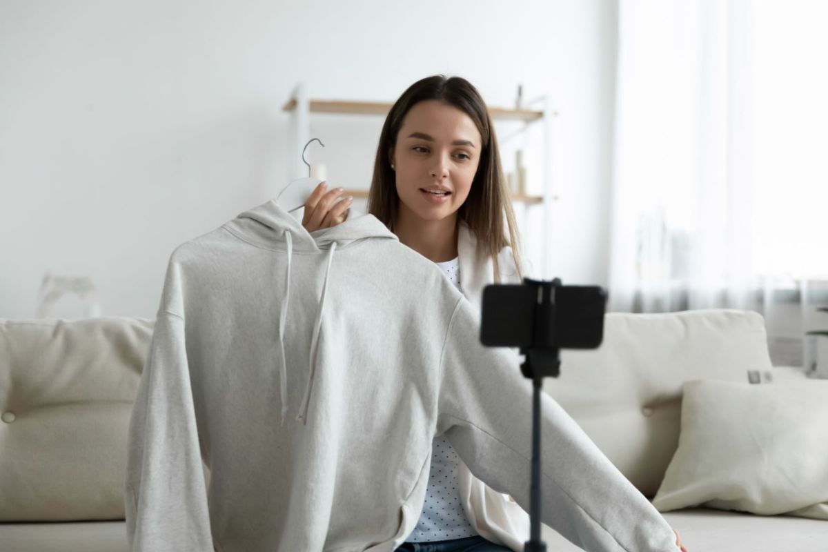 A lady is selling custom hoodies online by promoting them on her social media
