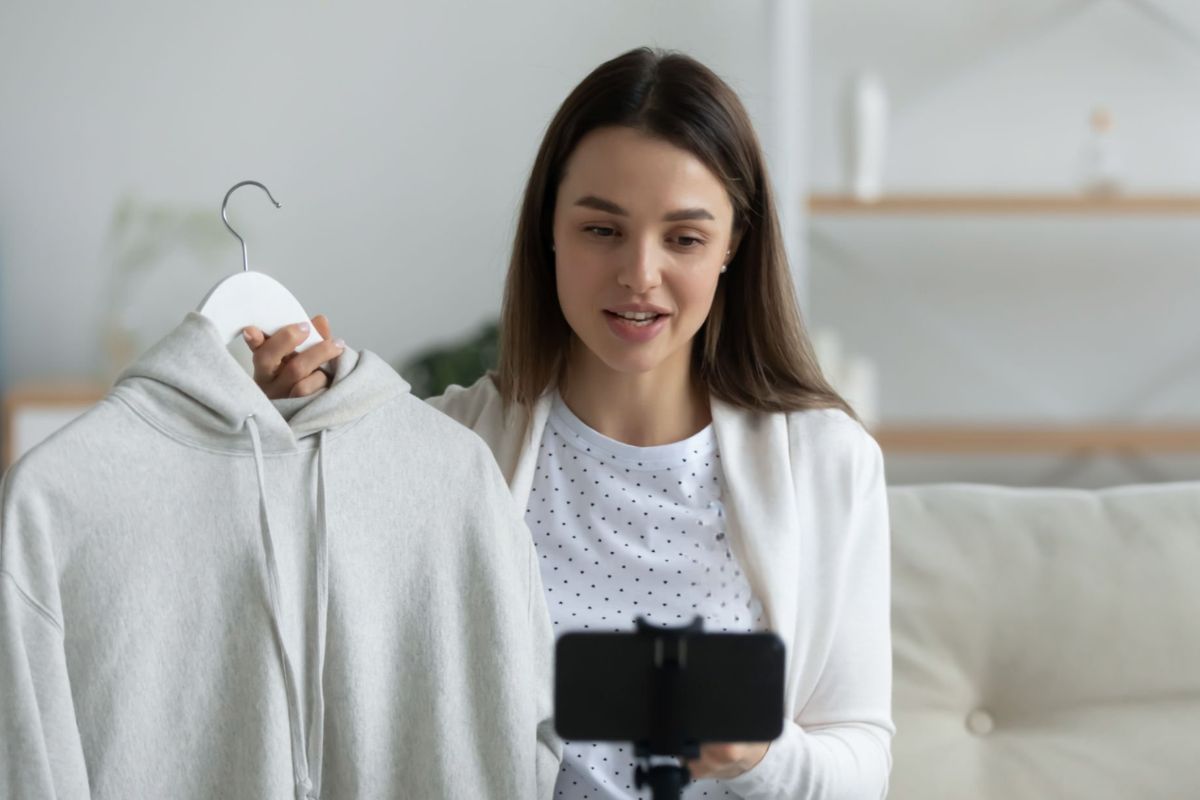 A lady marketing hoodies to boost sales online