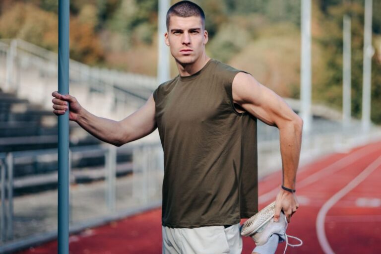 A person wearing a muscle tank t-shirt and exercising