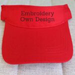 An embroidered sun visor is shown in the image