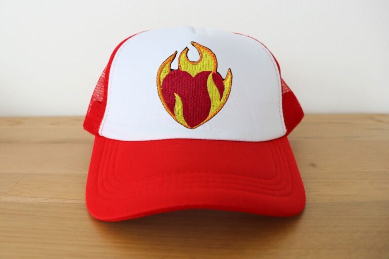 Embroidered trucker hat kept on a table