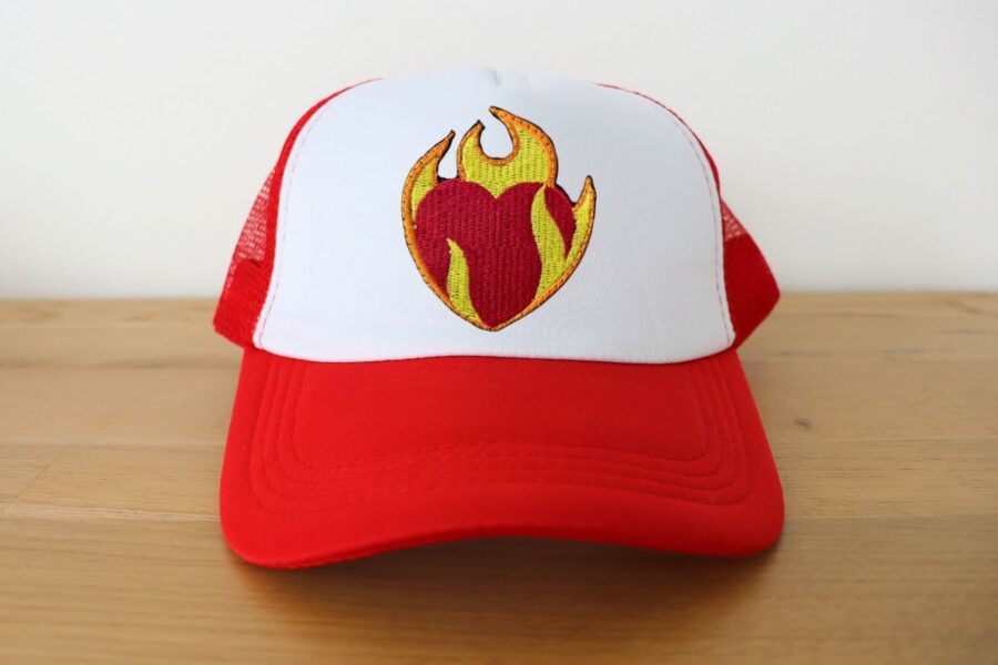 Embroidered trucker hat kept on a table