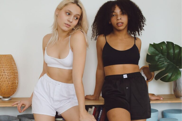 Two friends wearing women's high waisted shorts