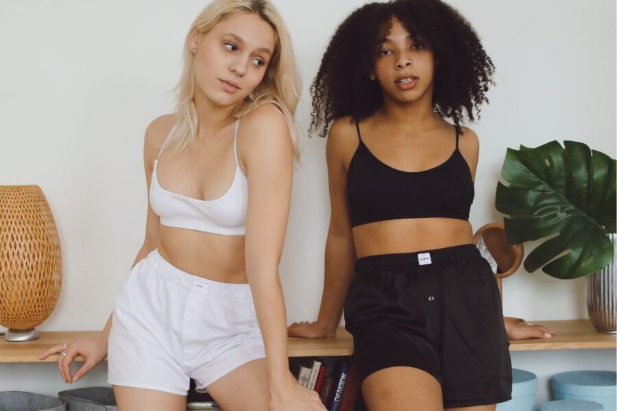Two friends wearing women's high waisted shorts