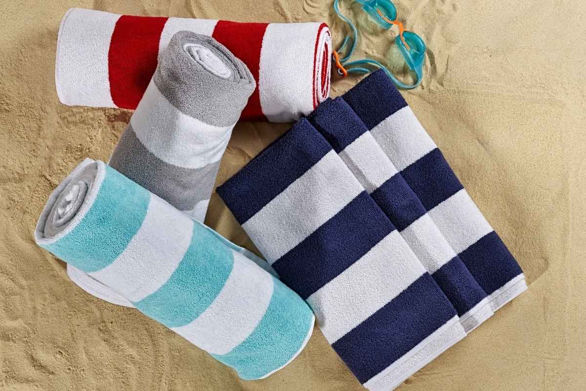 A collection of custom beach towels neatly stacked together