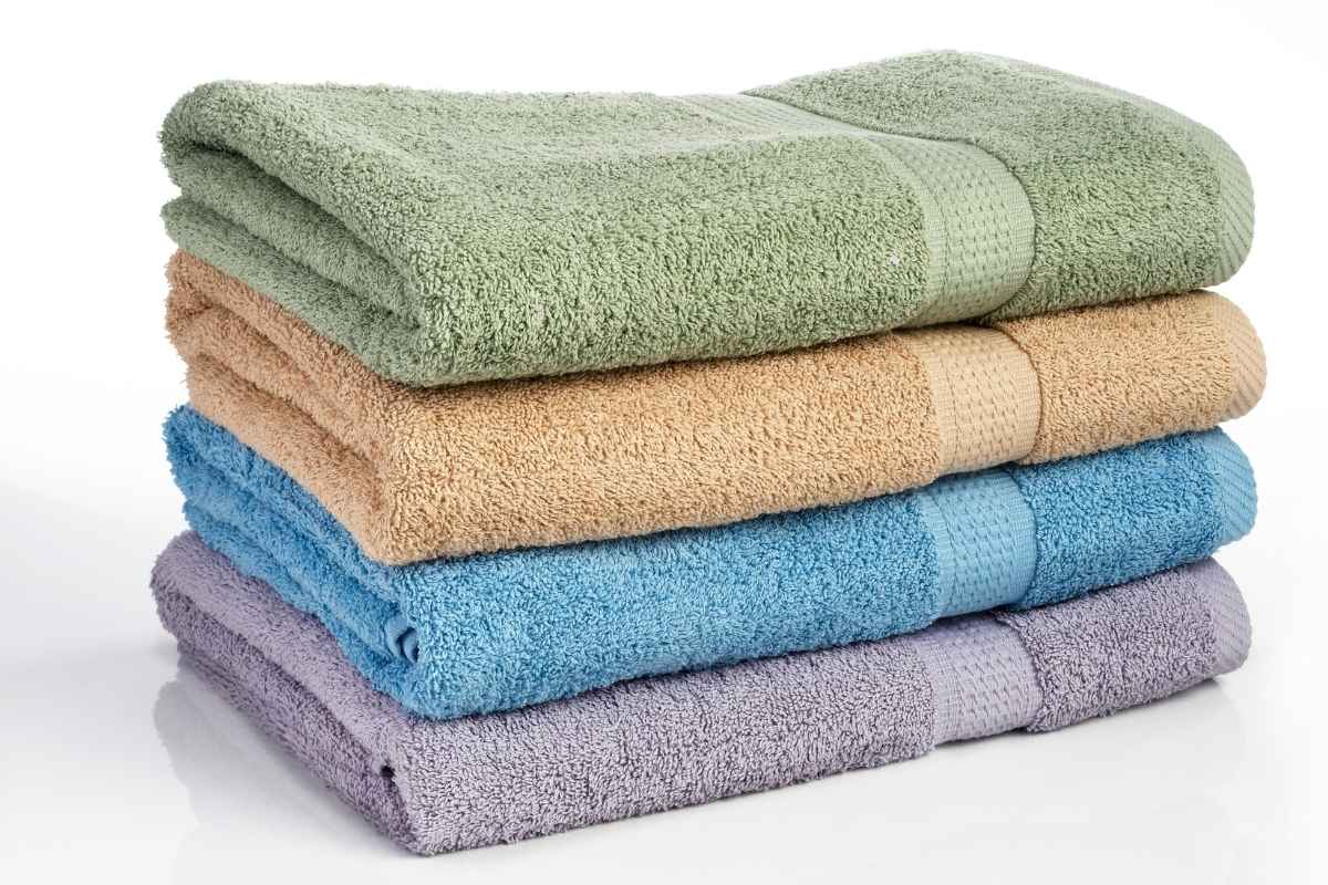 A collection of different colored custom beach towel