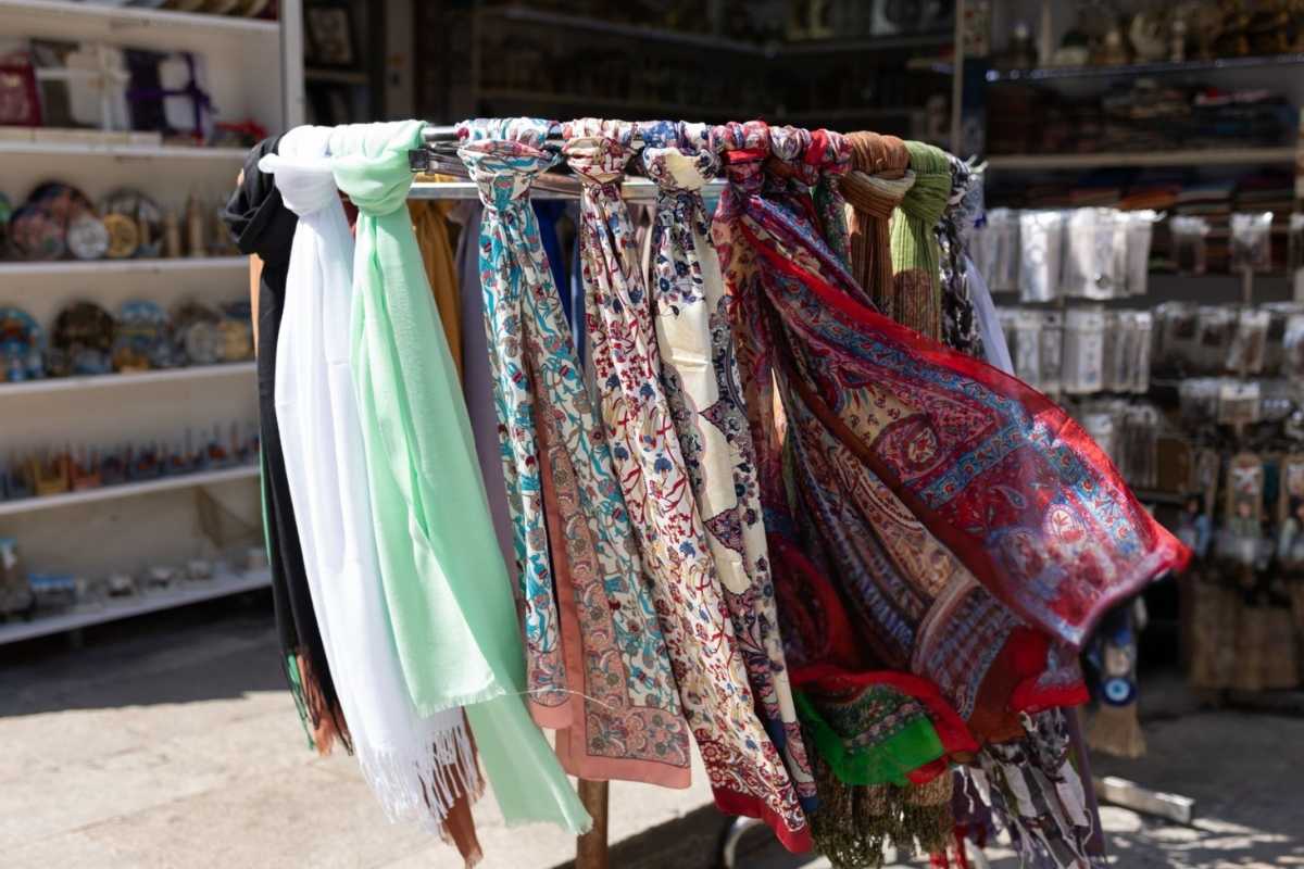 A collection of printed headscarves scarf kept outside the shop for sale