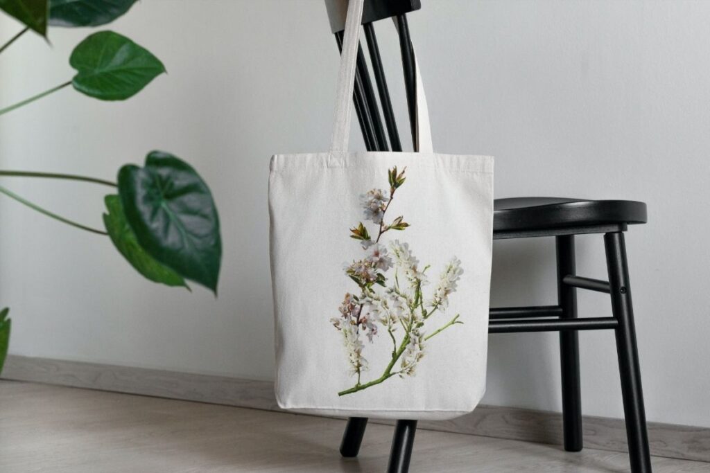 A custom canvas tote bag kept on a chair