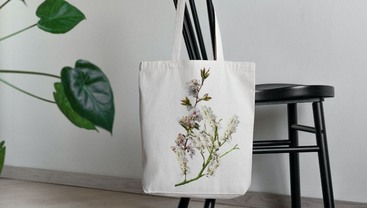 A custom canvas tote bag kept on a chair