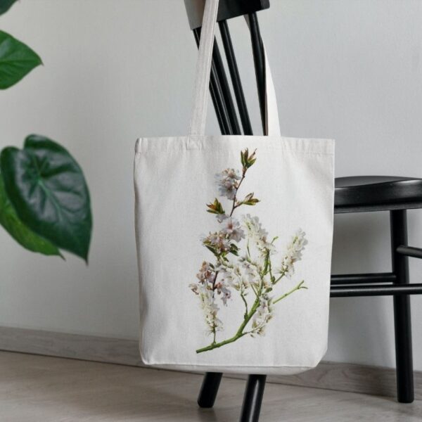 A custom canvas tote bag kept on a chair