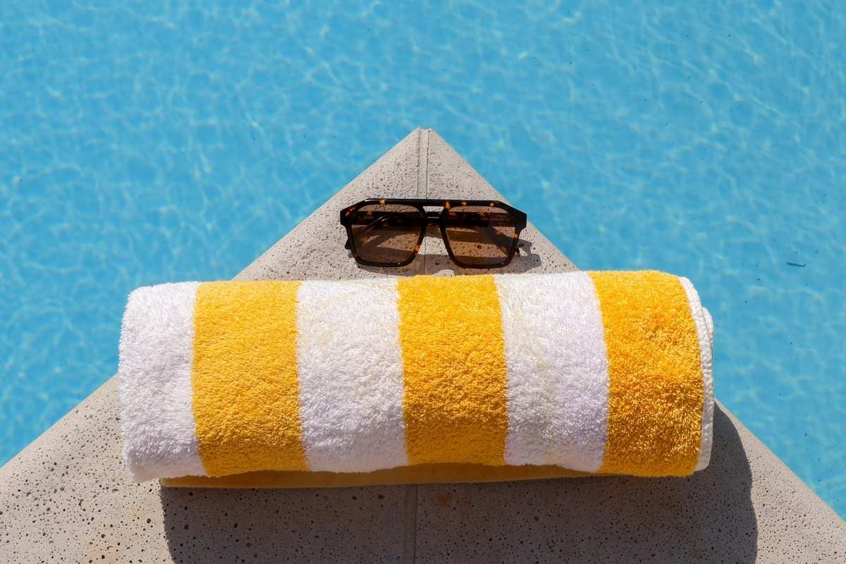 A custom towel kept at the side of the pool