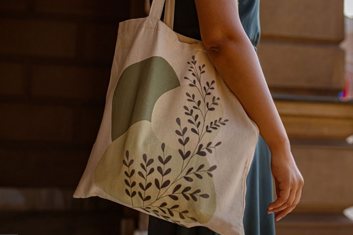 A lady holding her custom tote bag